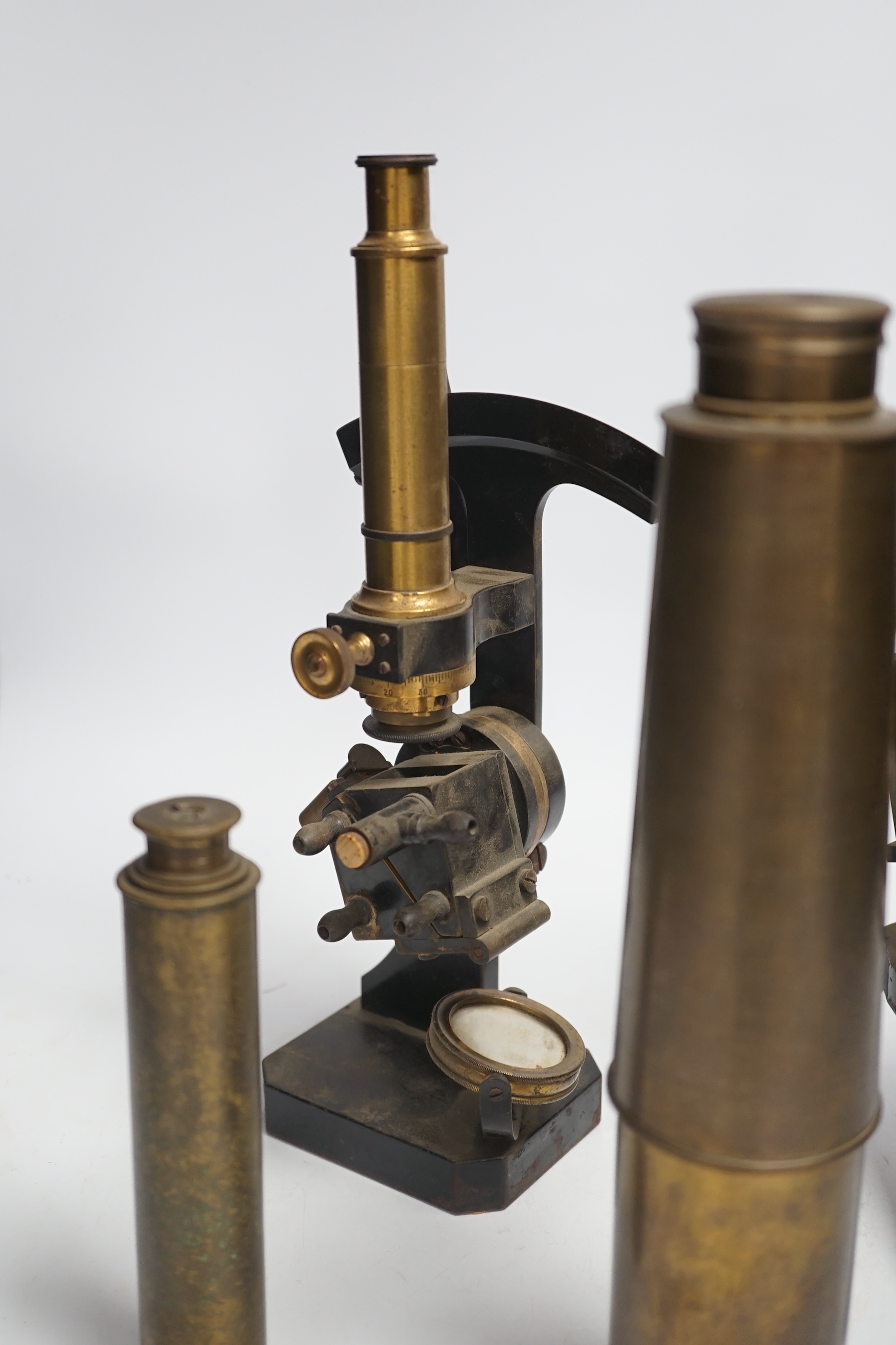 Two brass and black lacquered microscopes, one by Adam Hilger and two brass telescopes